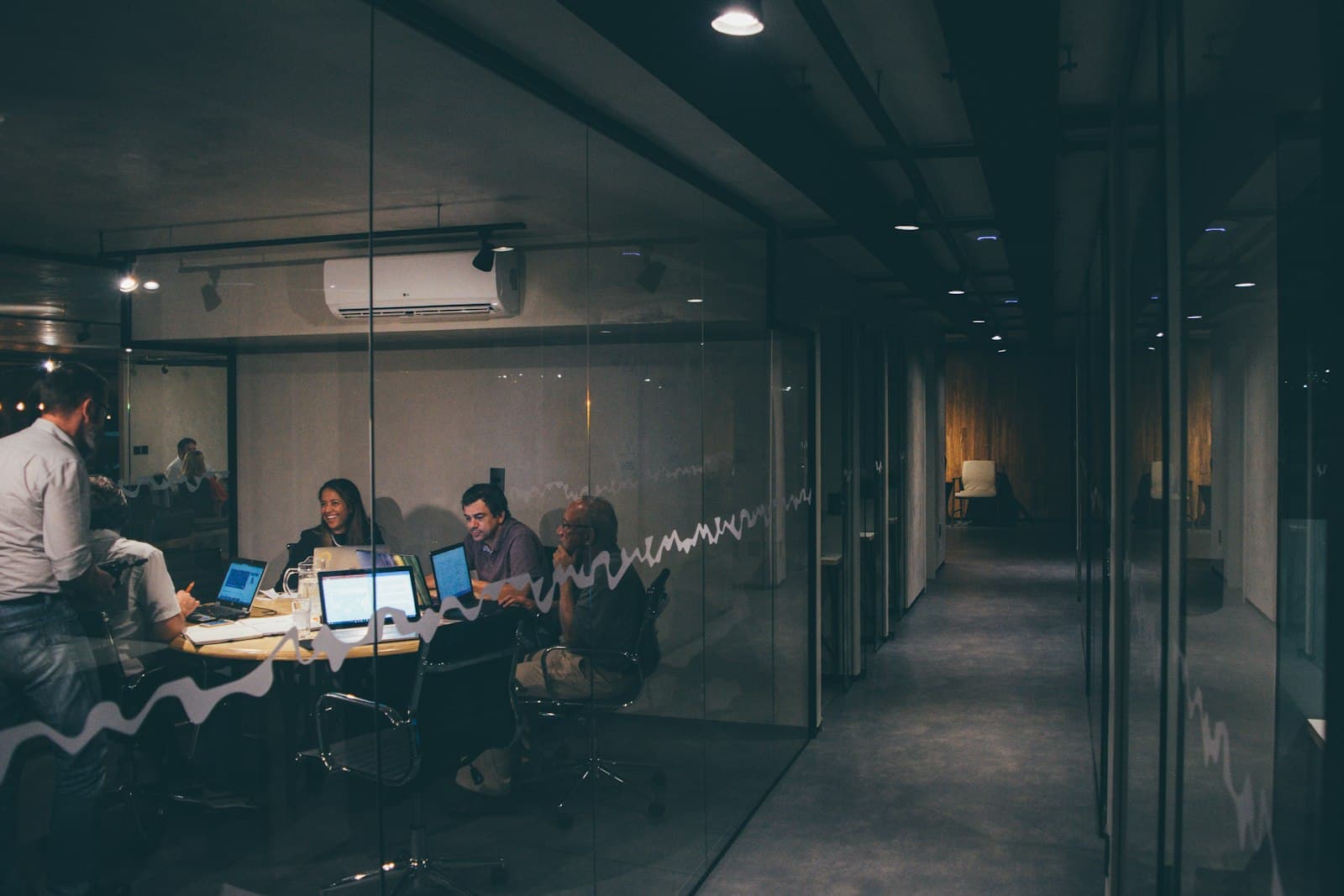 An audit meeting in a boardroom, illustrating ISO management-system certification.